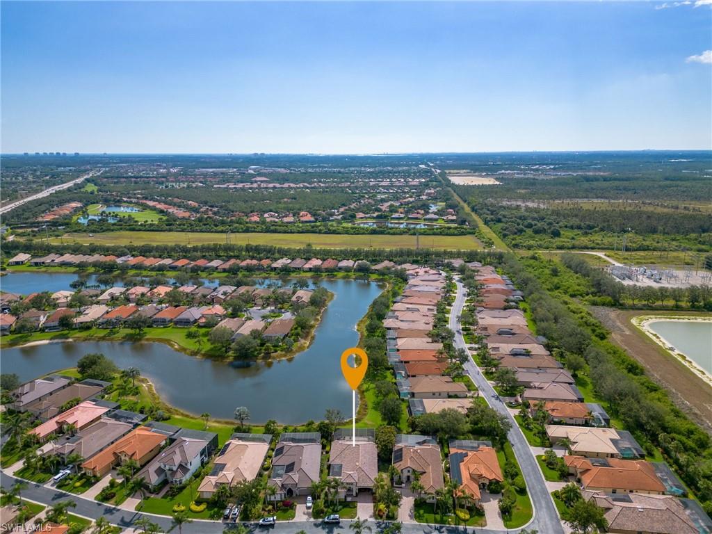 20002 Grande Lake Drive Estero, FL 33928 - Photo 30 of 38 an aerial view of ocean and residential houses with outdoor space