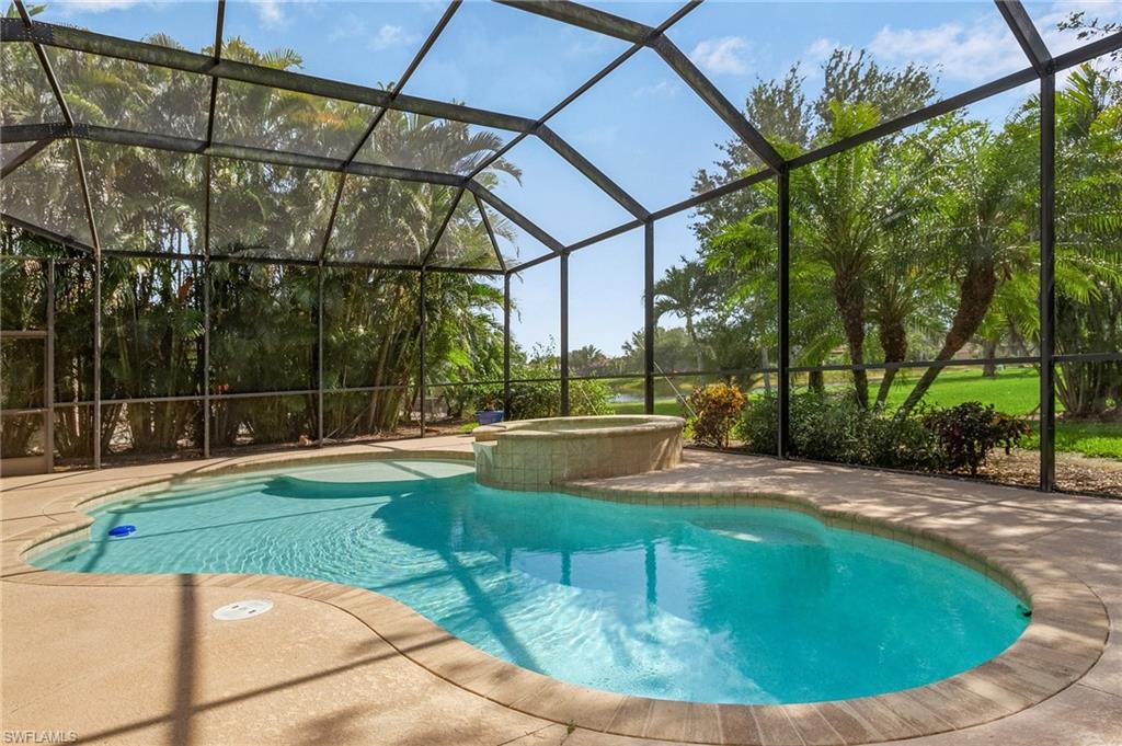 20002 Grande Lake Drive Estero, FL 33928 - Photo 5 of 38 a view of a swimming pool with a patio