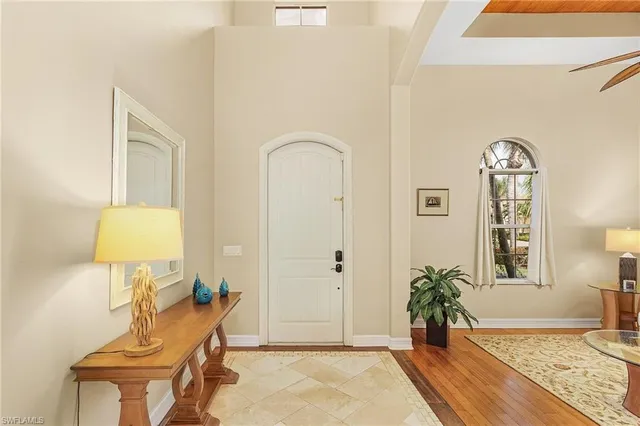a view of an entryway with wooden floor