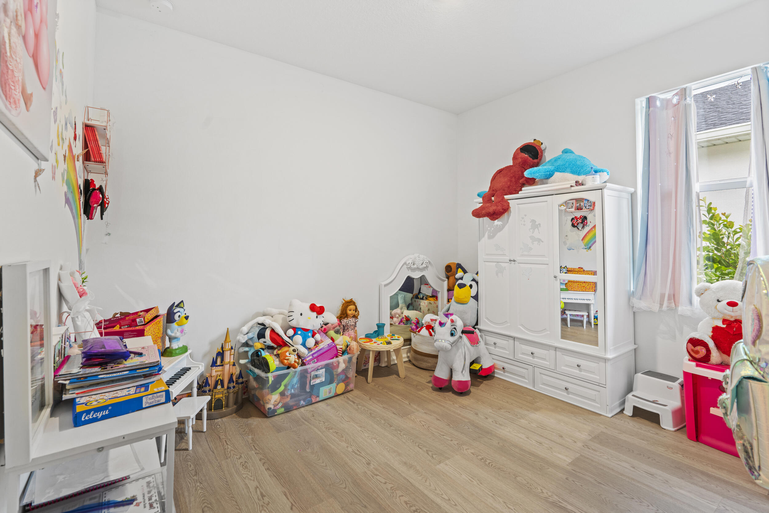 8906 Dahlia Circle Port St. Lucie, FL 34986 - Photo 22 of 47 a view of play room with toys and toys