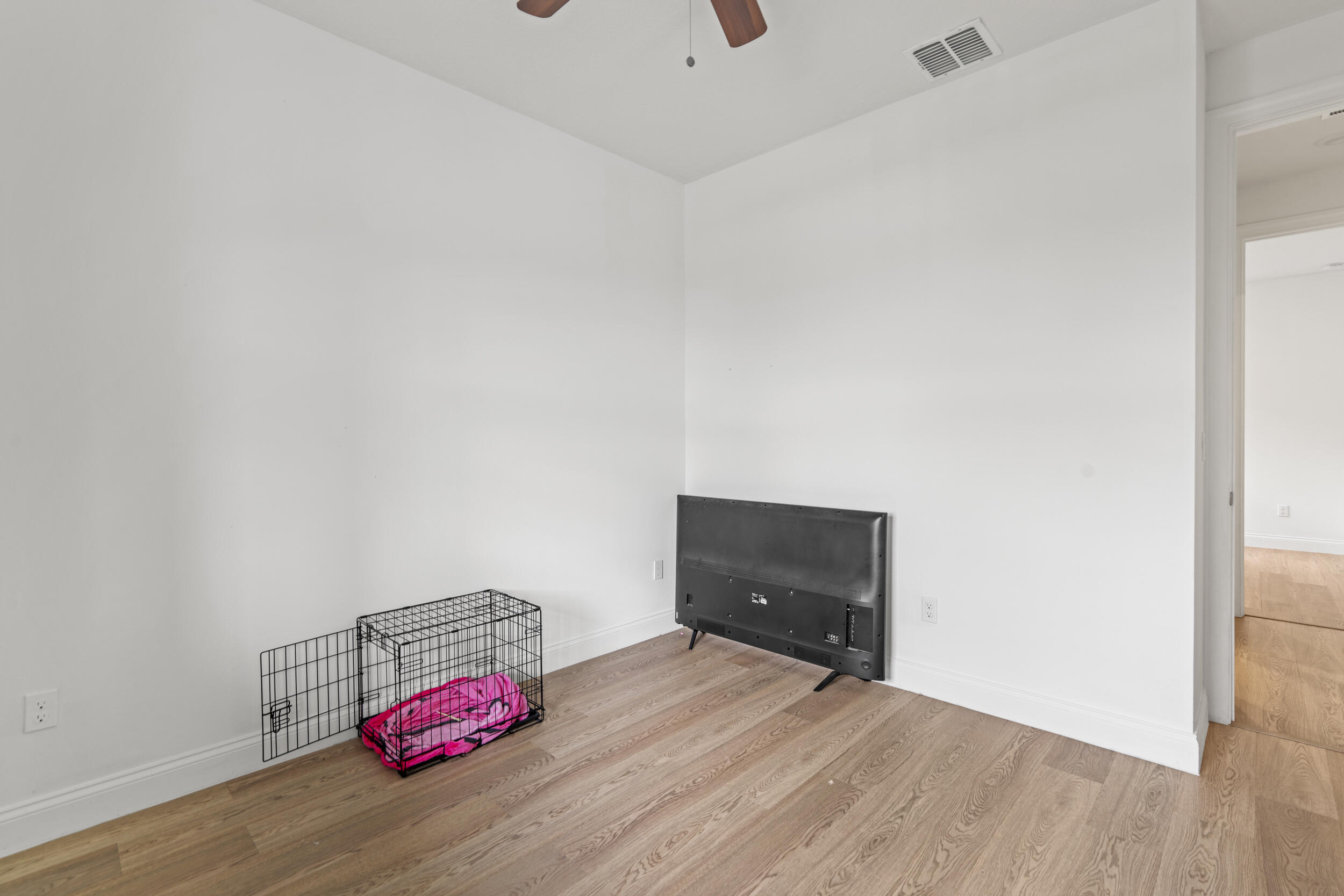 8906 Dahlia Circle Port St. Lucie, FL 34986 - Photo 24 of 47 a room with a bed and dresser