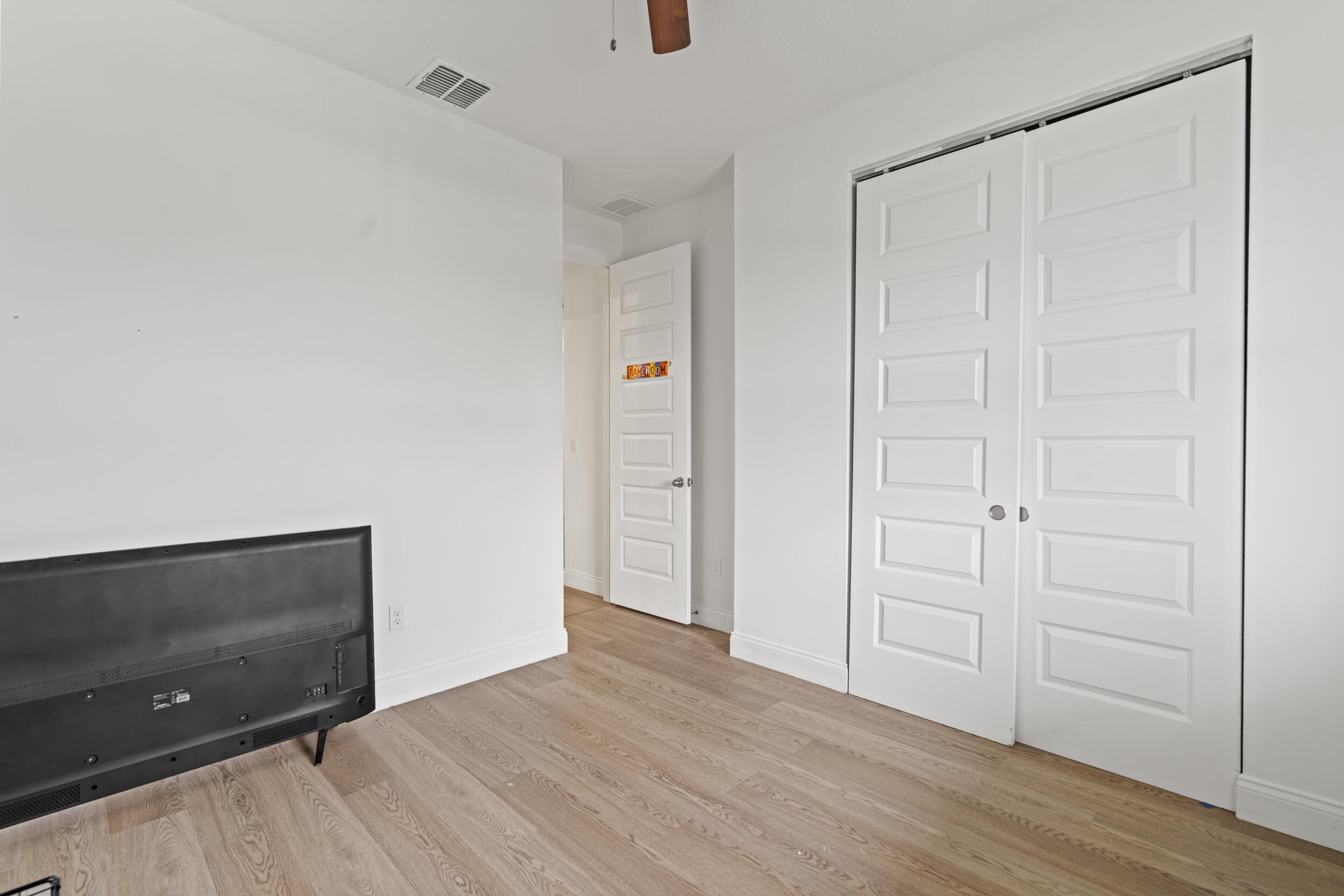 8906 Dahlia Circle Port St. Lucie, FL 34986 - Photo 25 of 47 a view of an empty room and wooden floor