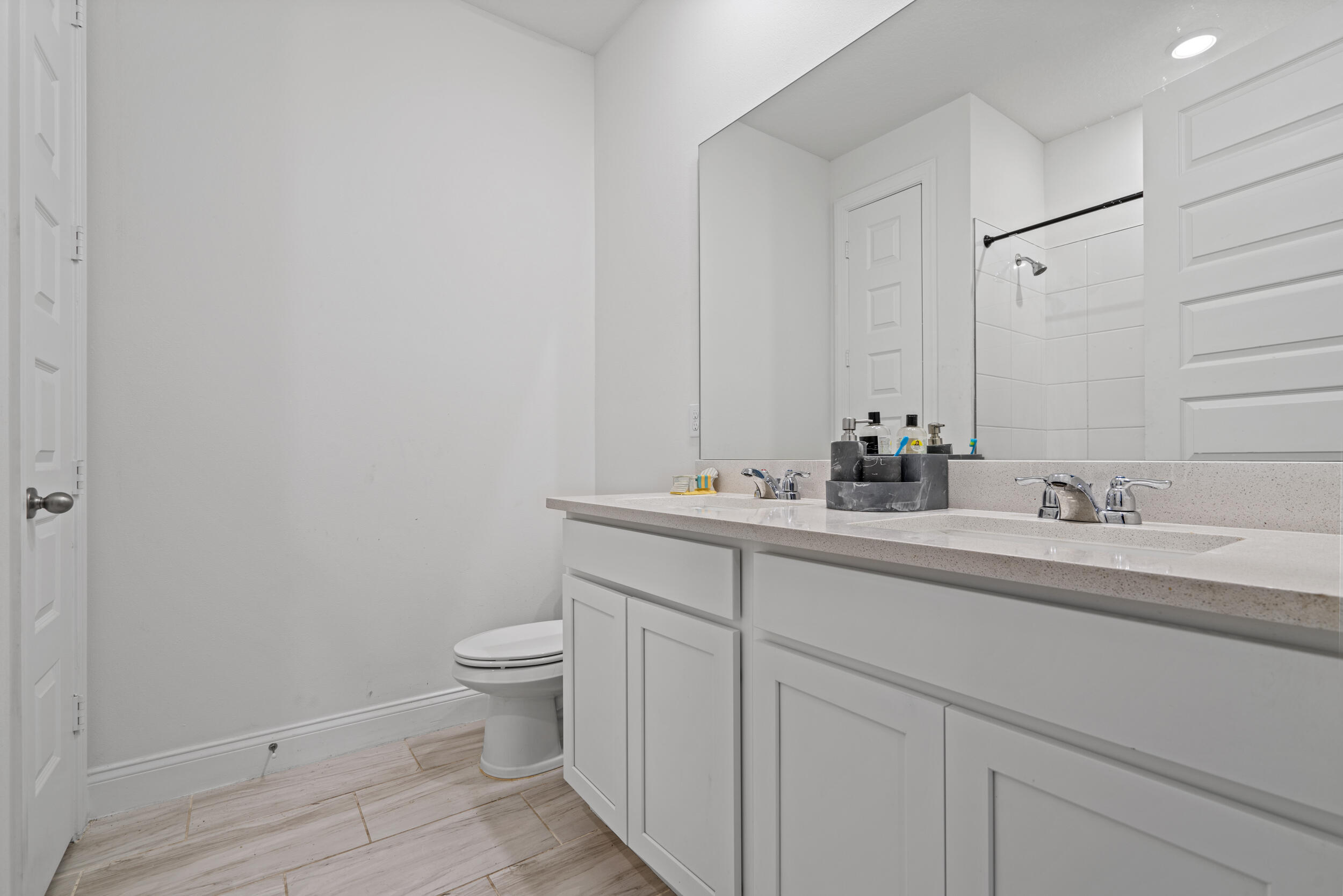 8906 Dahlia Circle Port St. Lucie, FL 34986 - Photo 28 of 47 a bathroom with a sink toilet and a mirror