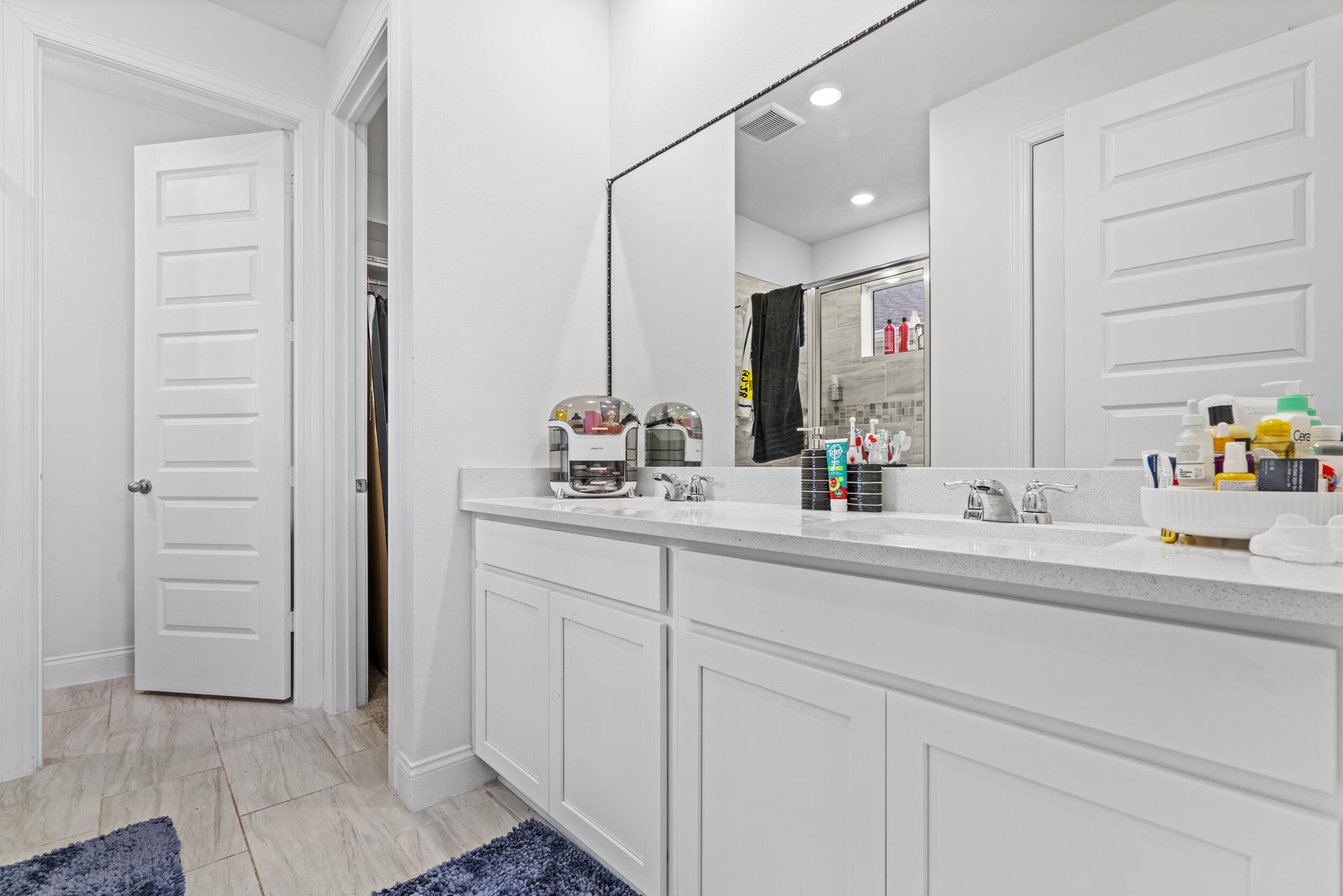 8906 Dahlia Circle Port St. Lucie, FL 34986 - Photo 29 of 47 a bathroom with a sink and a mirror