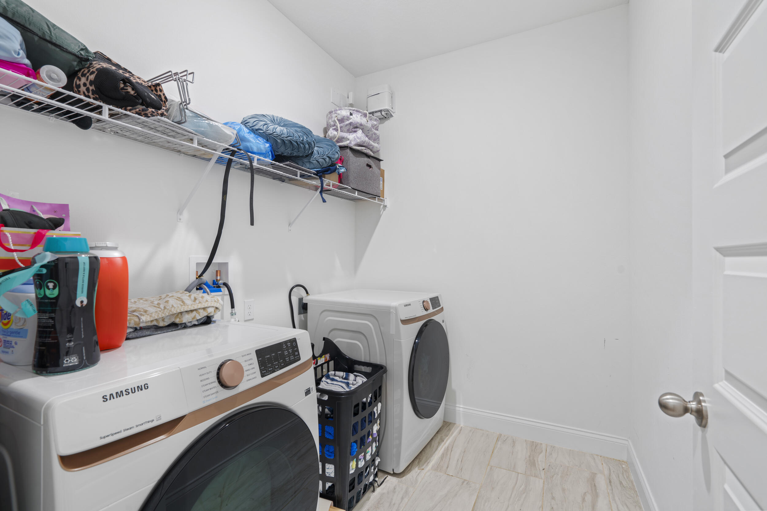 8906 Dahlia Circle Port St. Lucie, FL 34986 - Photo 30 of 47 a utility room with dryer and washer