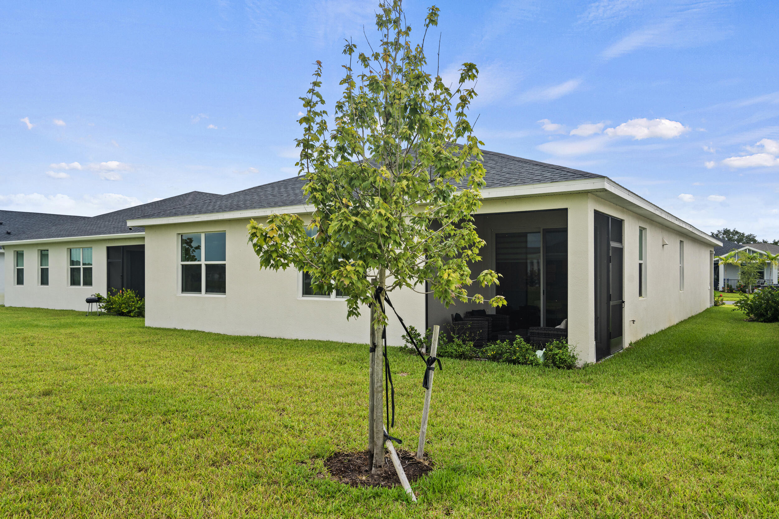 8906 Dahlia Circle Port St. Lucie, FL 34986 - Photo 34 of 47 a front view of a house with garden