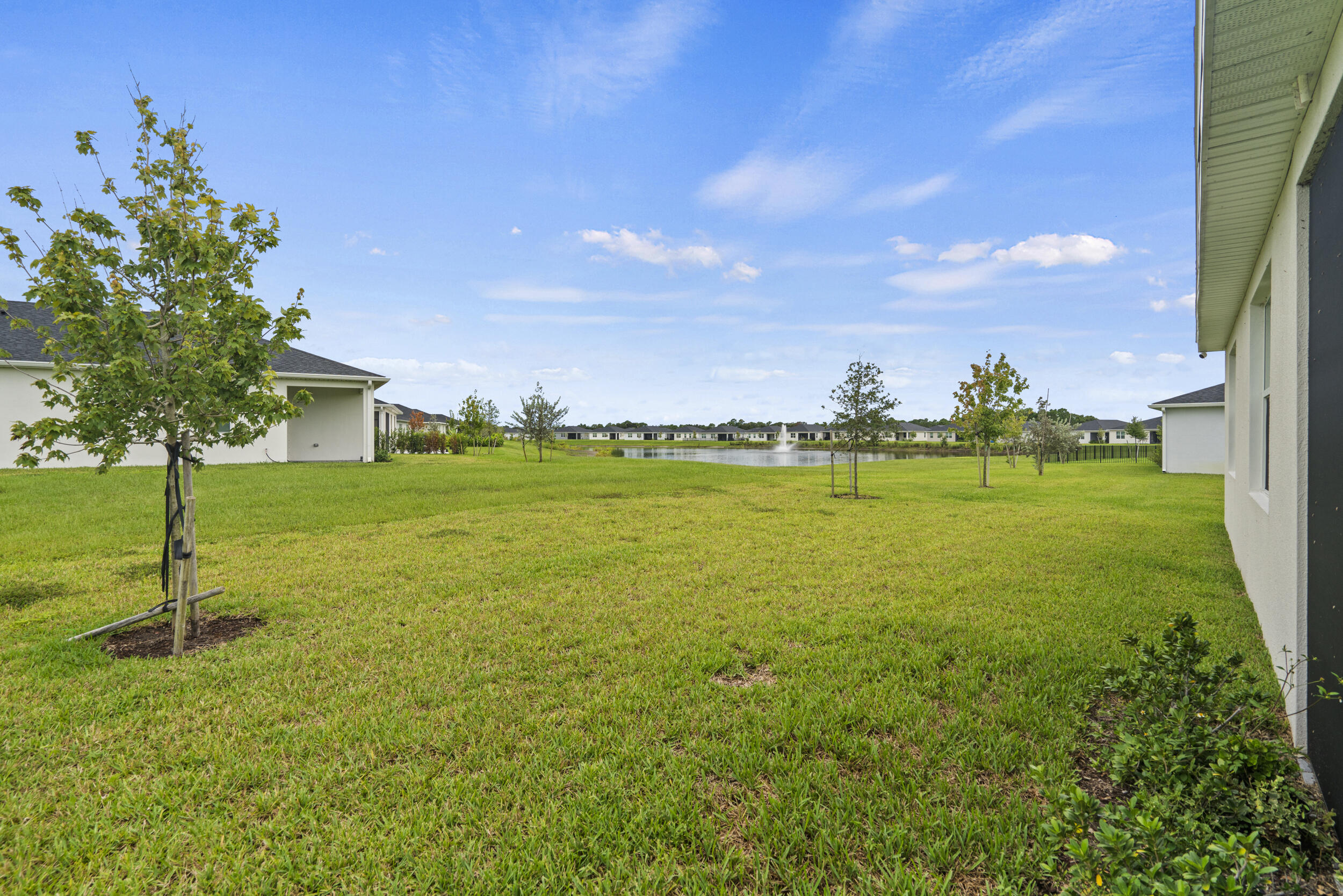 8906 Dahlia Circle Port St. Lucie, FL 34986 - Photo 37 of 47 a view of a garden with a house