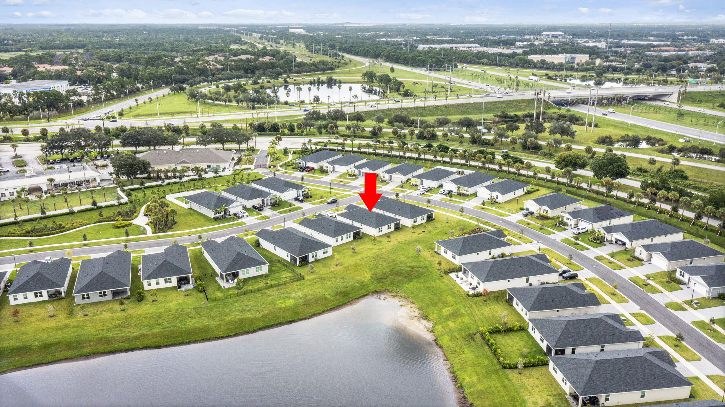 8906 Dahlia Circle Port St. Lucie, FL 34986 - Photo 42 of 47 an aerial view of residential houses with outdoor space and city view
