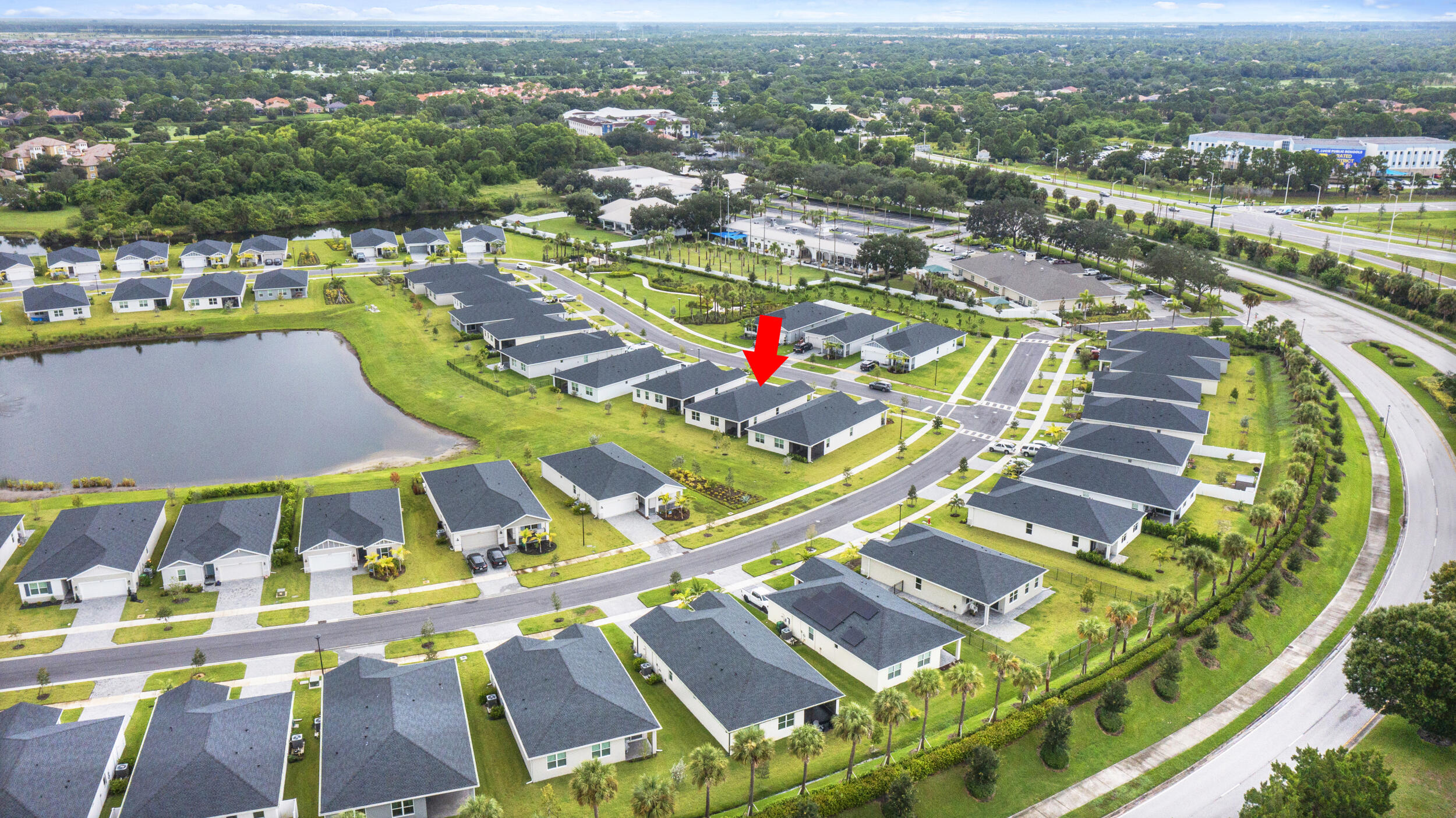 8906 Dahlia Circle Port St. Lucie, FL 34986 - Photo 43 of 47 an aerial view of residential houses with outdoor space and swimming pool