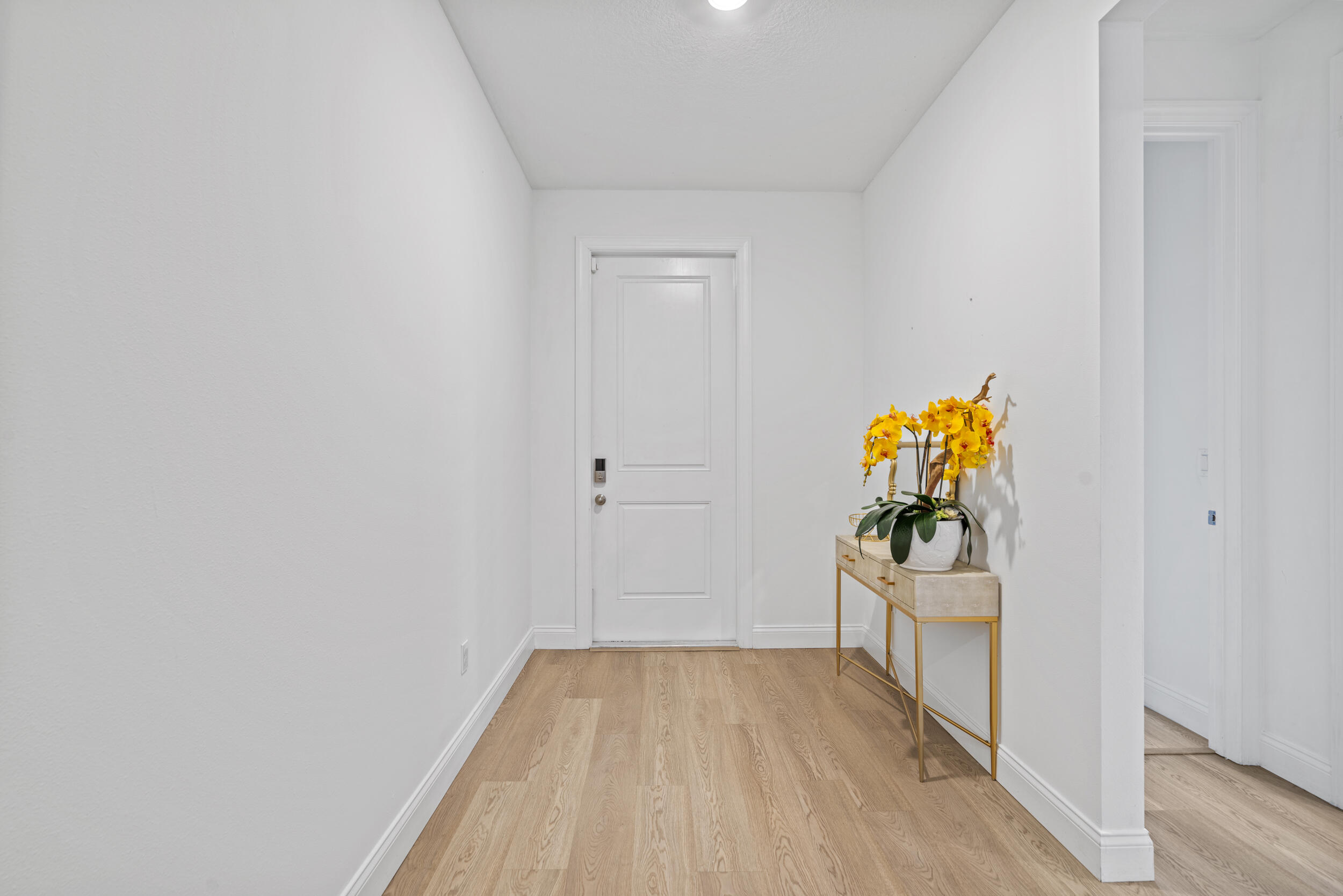 8906 Dahlia Circle Port St. Lucie, FL 34986 - Photo 6 of 47 a view of hallway with wooden floor
