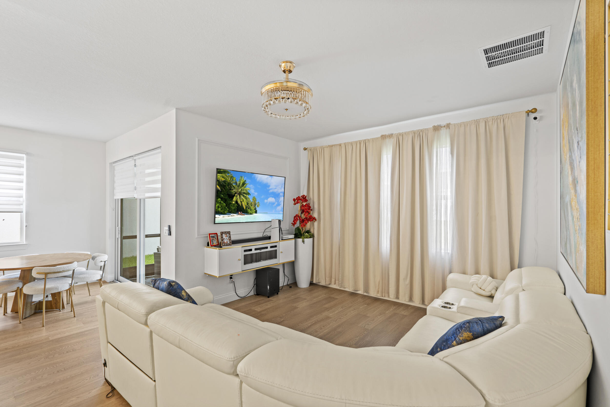 8906 Dahlia Circle Port St. Lucie, FL 34986 - Photo 8 of 47 a bedroom with a bed and a flat screen tv