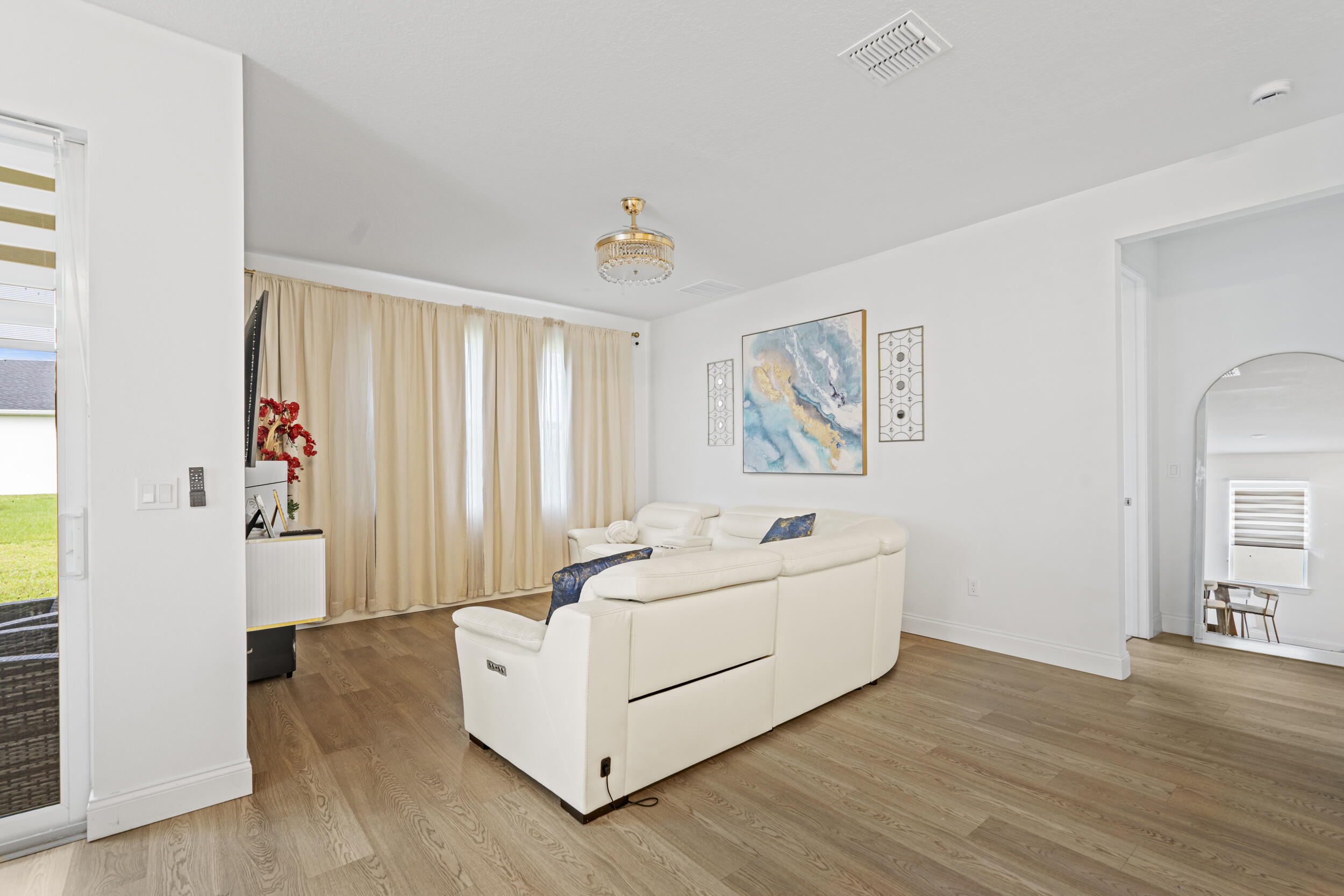 8906 Dahlia Circle Port St. Lucie, FL 34986 - Photo 9 of 47 a spacious bedroom with a bed and a window