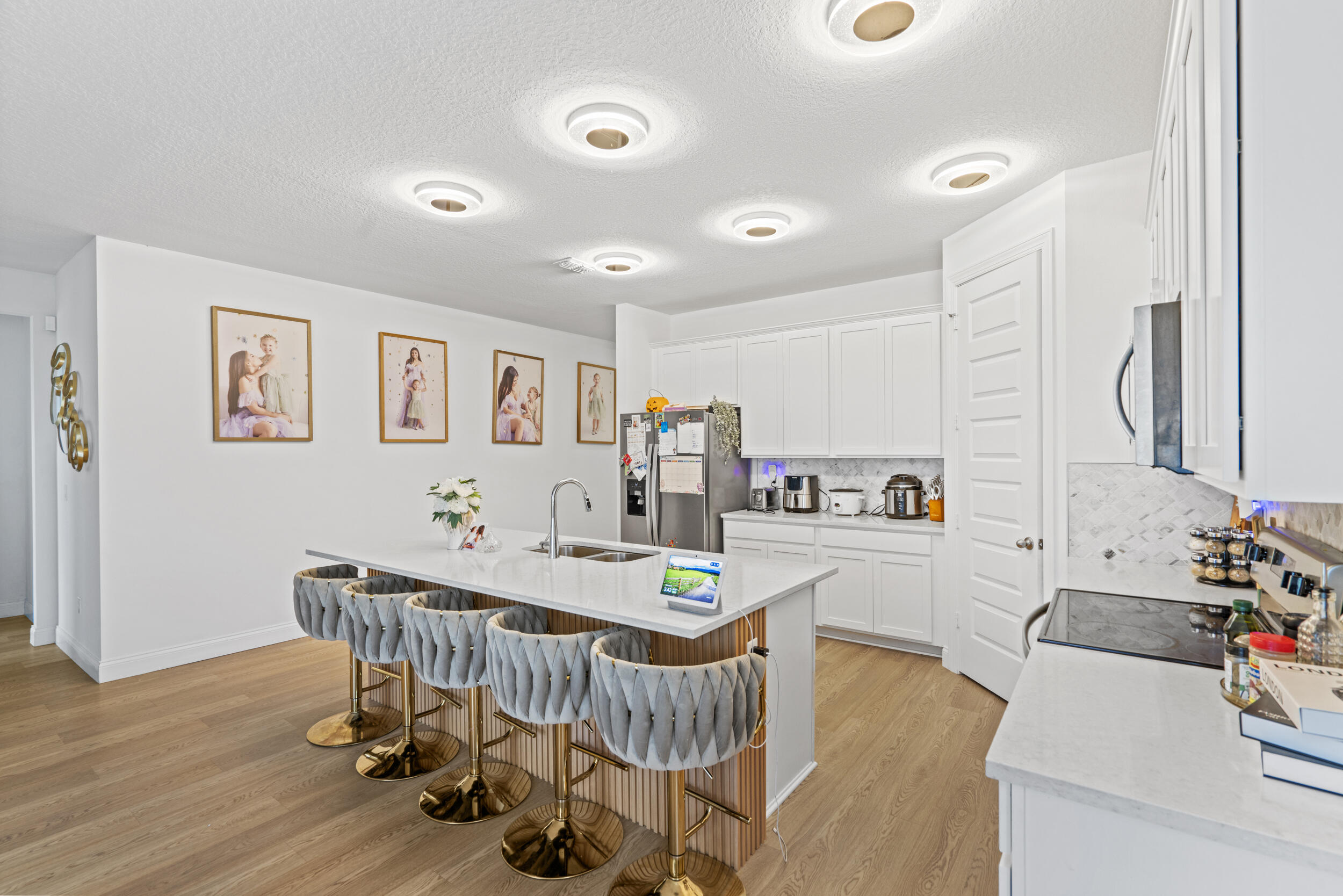 8906 Dahlia Circle Port St. Lucie, FL 34986 - Photo 10 of 47 a view of a dining room with furniture and wooden floor