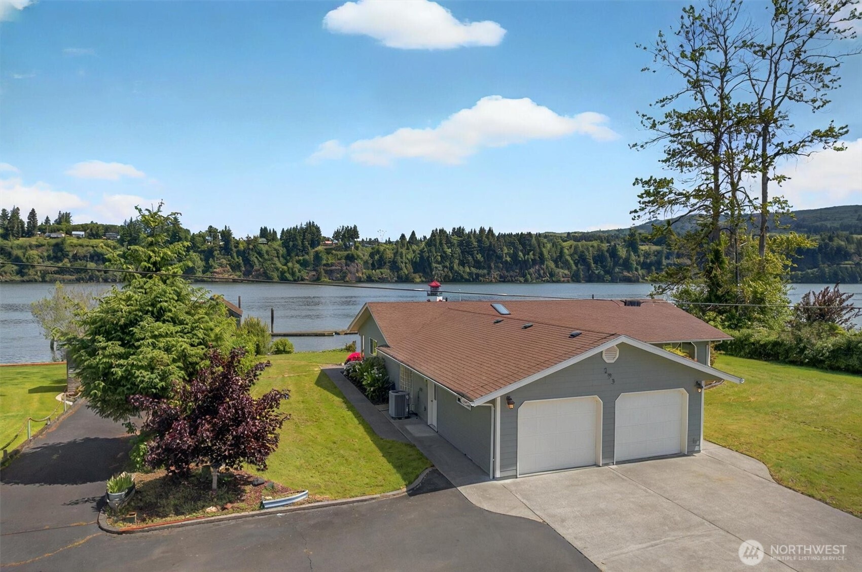 a view of a terrace with a garden and lake view