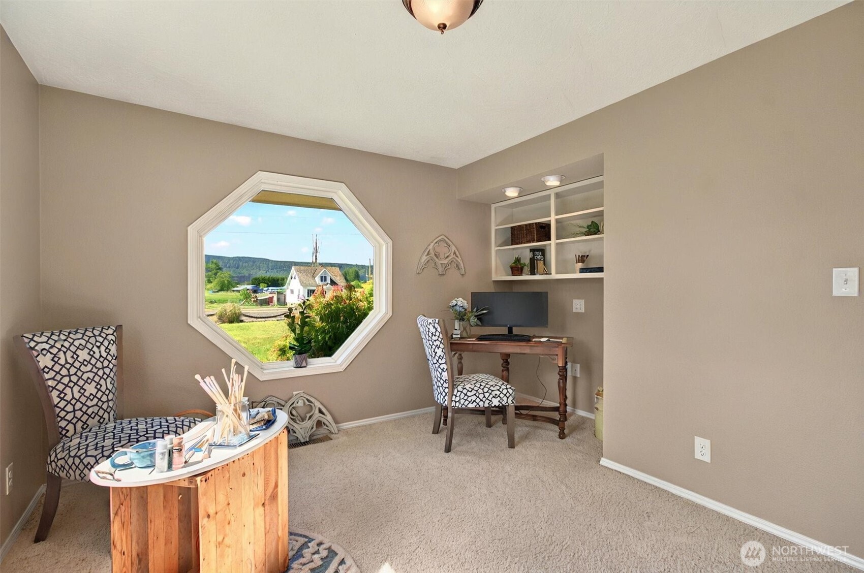 293 Highway 409 Cathlamet, WA 98612 - Photo 16 of 39 a living room with furniture and a flat screen tv