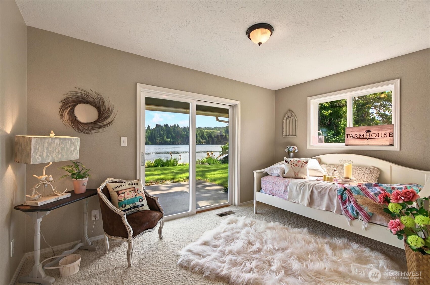 293 Highway 409 Cathlamet, WA 98612 - Photo 18 of 39 a living room with furniture and a large window