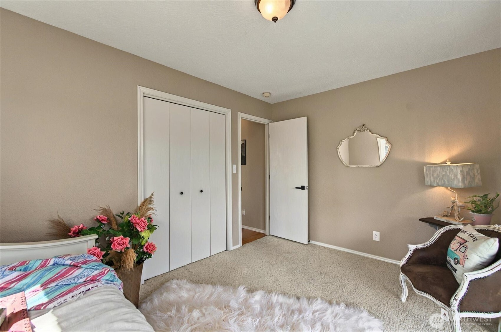 293 Highway 409 Cathlamet, WA 98612 - Photo 19 of 39 a bed room with a bed and a chandelier
