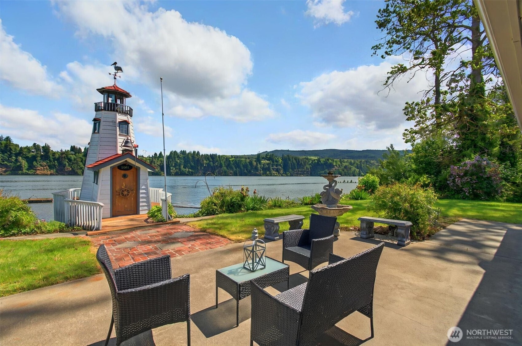 293 Highway 409 Cathlamet, WA 98612 - Photo 2 of 39 a view of a patio with furniture and city view