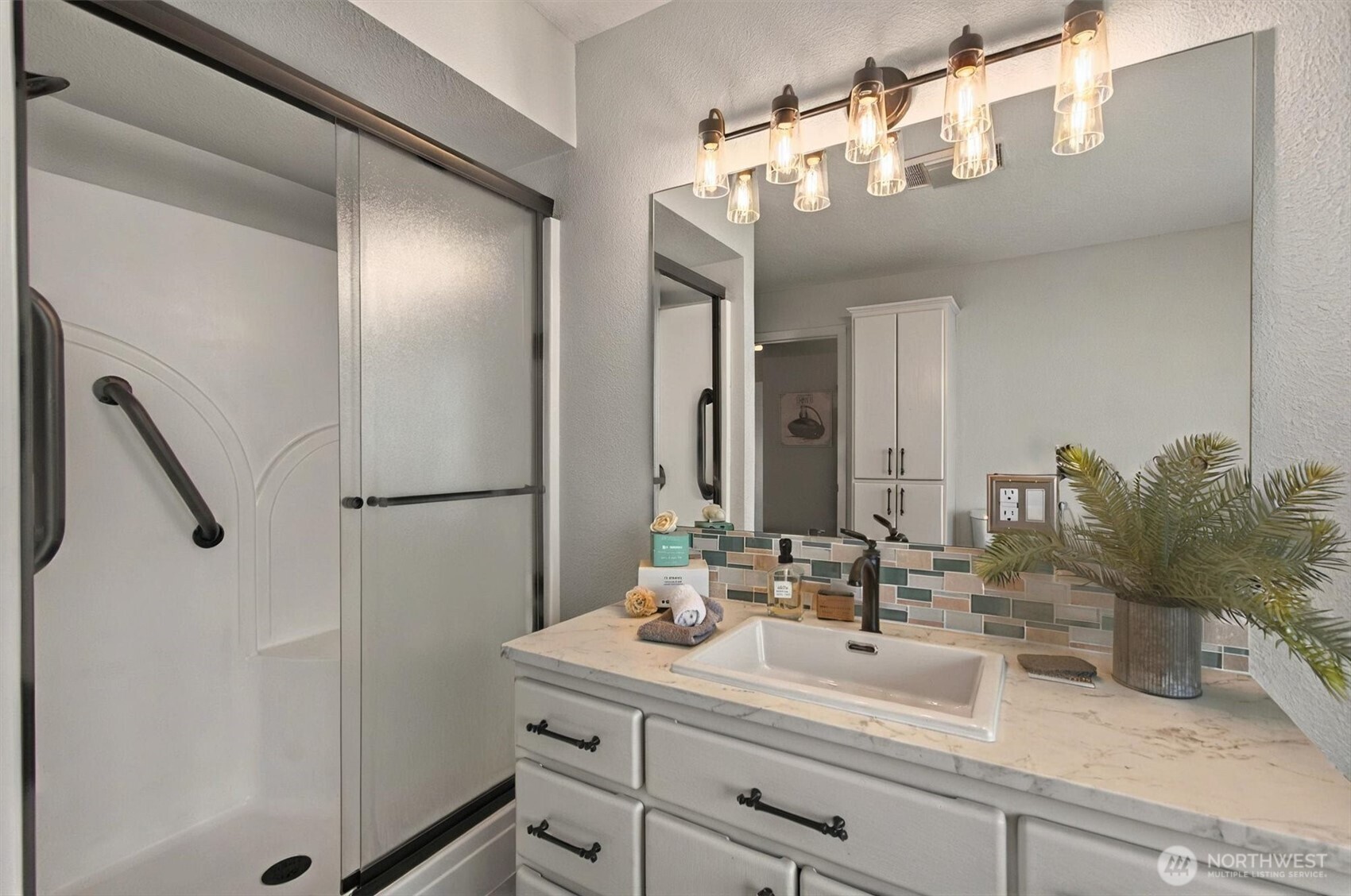 293 Highway 409 Cathlamet, WA 98612 - Photo 25 of 39 a bathroom with a sink and a mirror