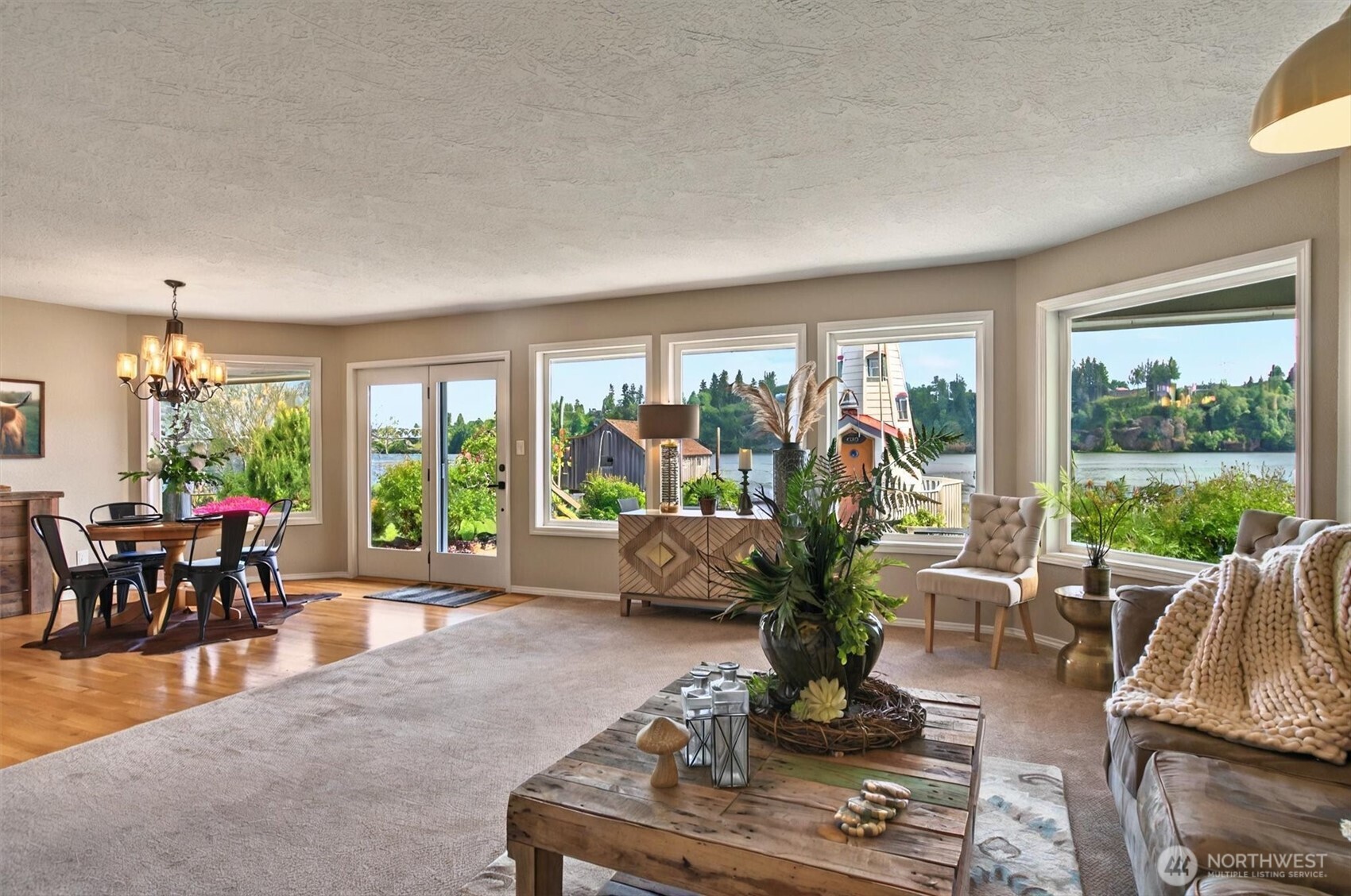 293 Highway 409 Cathlamet, WA 98612 - Photo 5 of 39 a living room with furniture potted plant and a large window