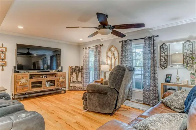 a kitchen with stainless steel appliances a stove a microwave and cabinets