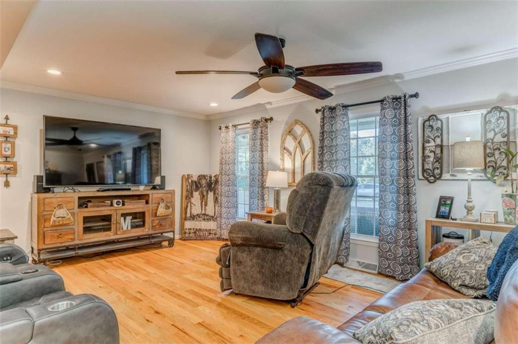 1522 Collard Valley Road Cedartown, GA 30125 - Photo 12 of 56 a living room with furniture and a flat screen tv