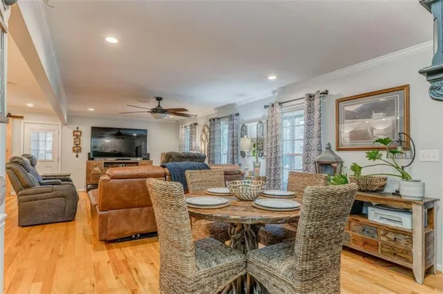 a kitchen with granite countertop white cabinets and a stove