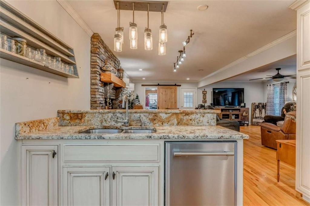 1522 Collard Valley Road Cedartown, GA 30125 - Photo 17 of 56 a view of a kitchen with stainless steel appliances granite countertop a sink and cabinets
