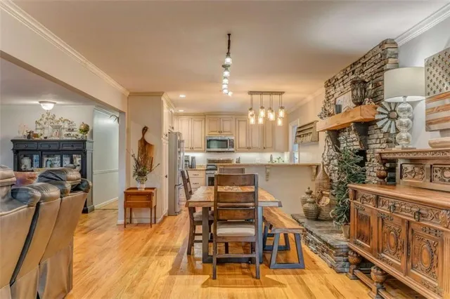 a dining room with a table and chairs