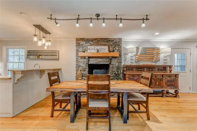 a view of a dining room with furniture window and wooden floor