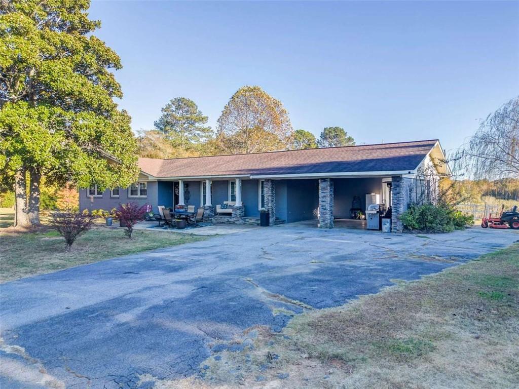 1522 Collard Valley Road Cedartown, GA 30125 - Photo 2 of 56 a view of a house with a yard and garage