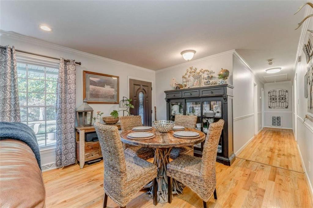1522 Collard Valley Road Cedartown, GA 30125 - Photo 22 of 56 a view of a dining room with furniture window and wooden floor