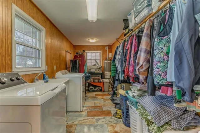 a bedroom with a bed dresser and a window