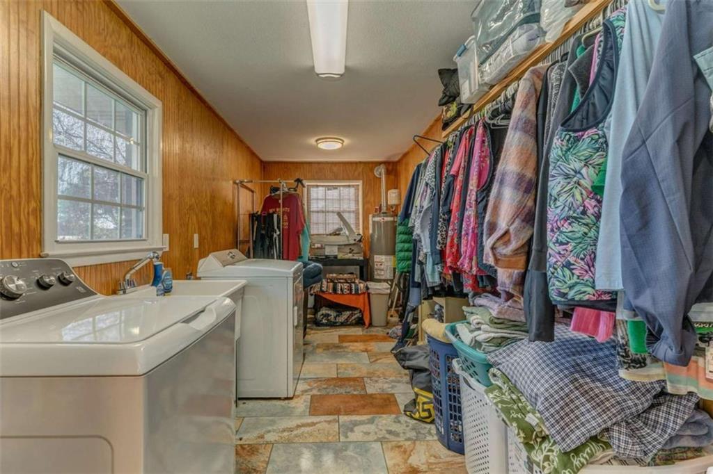 1522 Collard Valley Road Cedartown, GA 30125 - Photo 23 of 56 a view of walk in closet with clothes and shoes