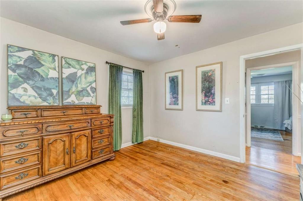 1522 Collard Valley Road Cedartown, GA 30125 - Photo 24 of 56 a bedroom with a large bed and a large window