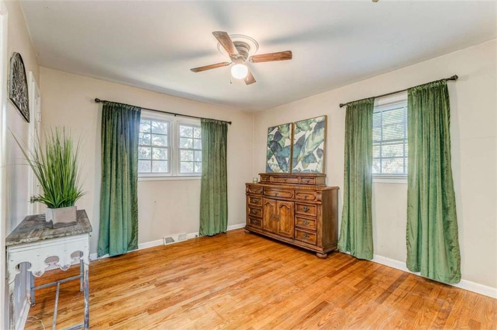 1522 Collard Valley Road Cedartown, GA 30125 - Photo 25 of 56 a bedroom with a bed dresser and a window