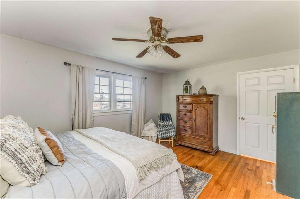 1522 Collard Valley Road Cedartown, GA 30125 - Photo 31 of 56 a bedroom with a bed and wooden floor