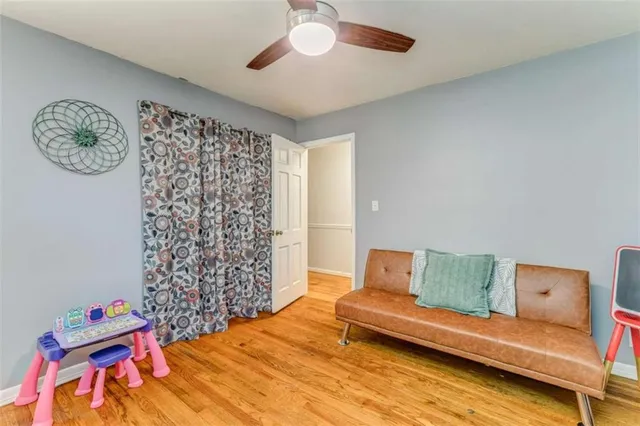 a bathroom with a granite countertop toilet sink and mirror