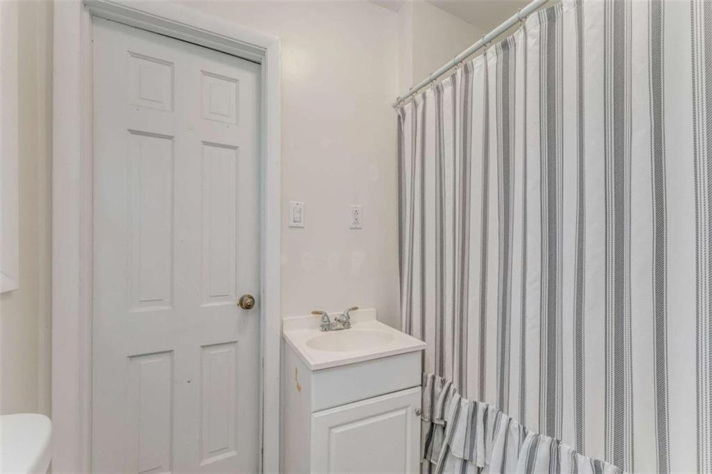 1522 Collard Valley Road Cedartown, GA 30125 - Photo 35 of 56 a bathroom with a sink a toilet and shower