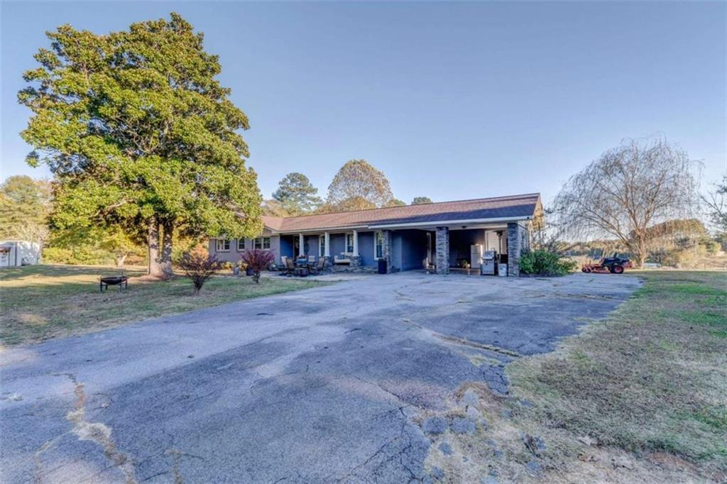 1522 Collard Valley Road Cedartown, GA 30125 - Photo 42 of 56 a view of a house with a yard and tree s