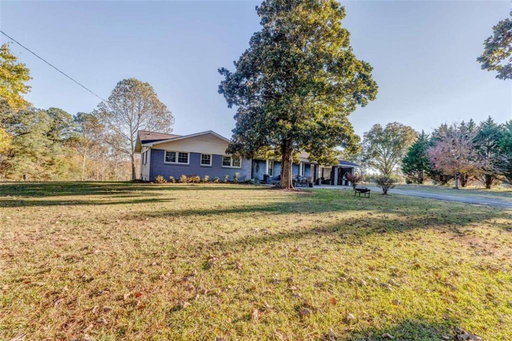 1522 Collard Valley Road Cedartown, GA 30125 - Photo 44 of 56 a front view of a house with a yard