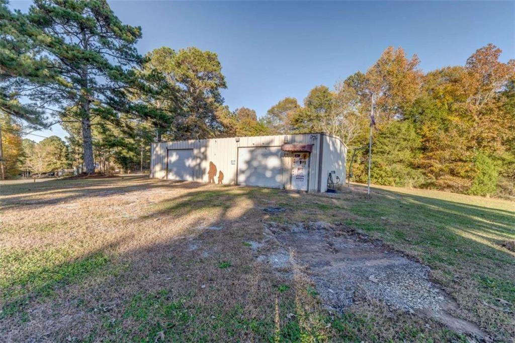 1522 Collard Valley Road Cedartown, GA 30125 - Photo 48 of 56 a view of dirt yard with a building in the background