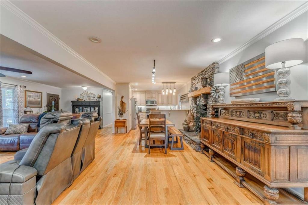 1522 Collard Valley Road Cedartown, GA 30125 - Photo 6 of 56 a view of a kitchen with furniture and wooden floor