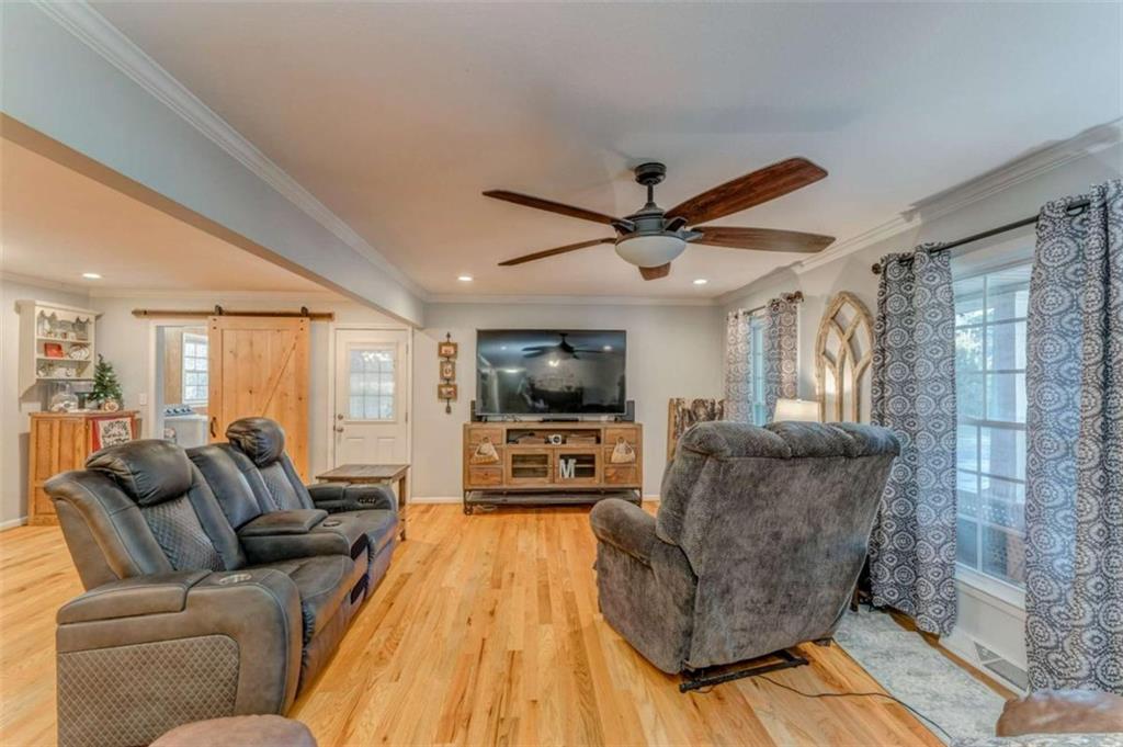 1522 Collard Valley Road Cedartown, GA 30125 - Photo 10 of 56 a living room with furniture and a flat screen tv