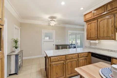 a kitchen with a sink cabinets and appliances