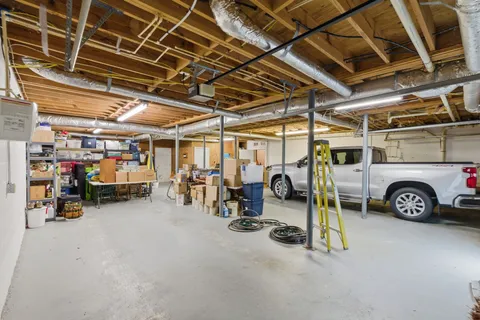 a view of parking garage with cars