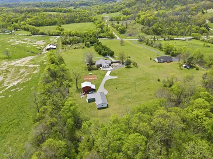 an aerial view of a garden with an outdoor seating