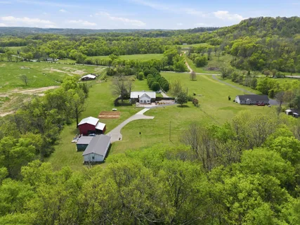a view of a garden with a building in the background