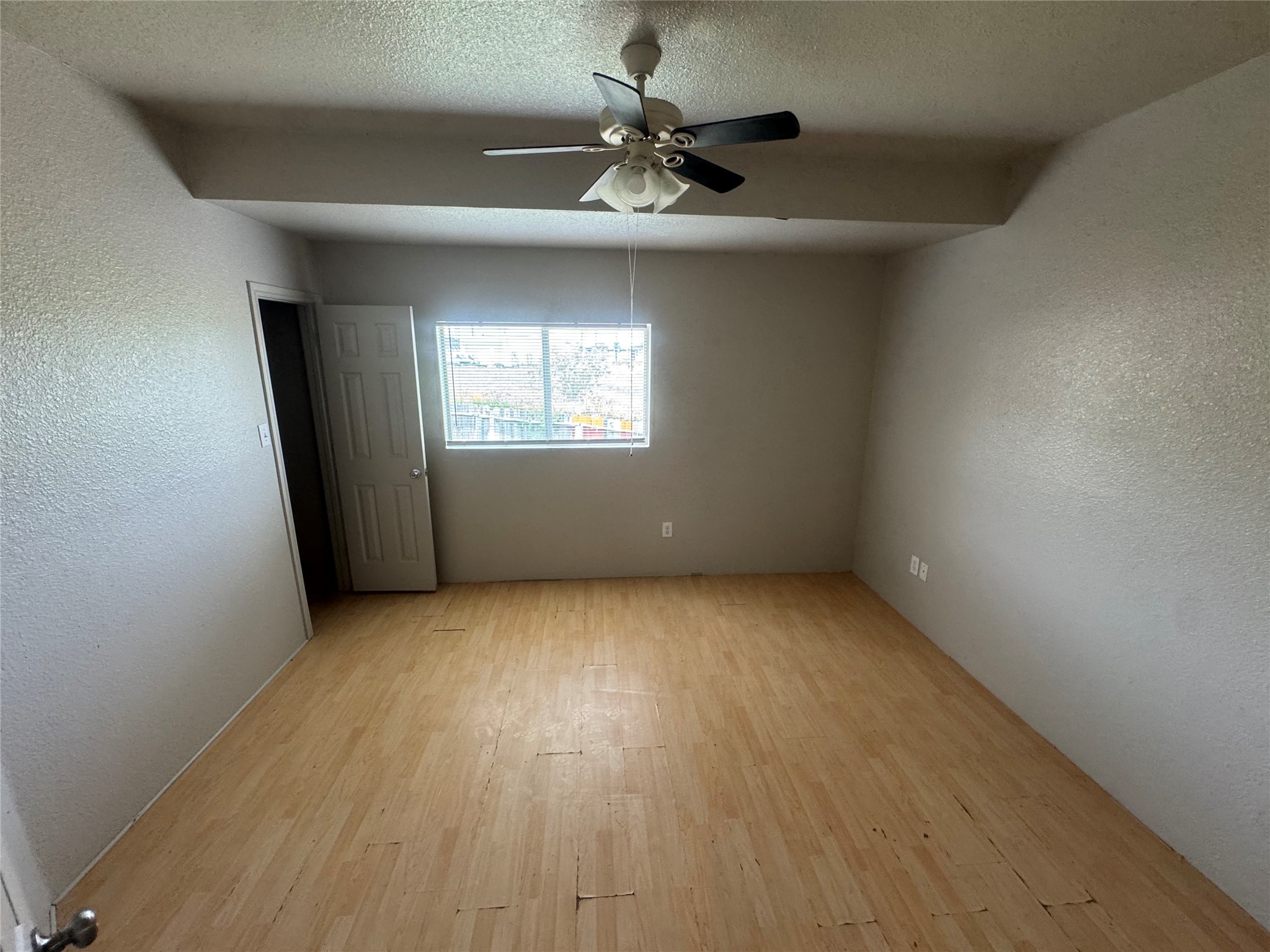 4411 Terra Summit Road San Antonio, TX 78233 - Photo 11 of 11 Room featuring wood-finish flooring, a ceiling fan with integrated lighting, and a multi-pane window
