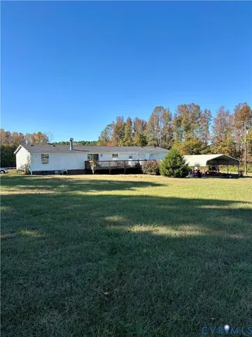 a bedroom with furniture a chandelier and a window